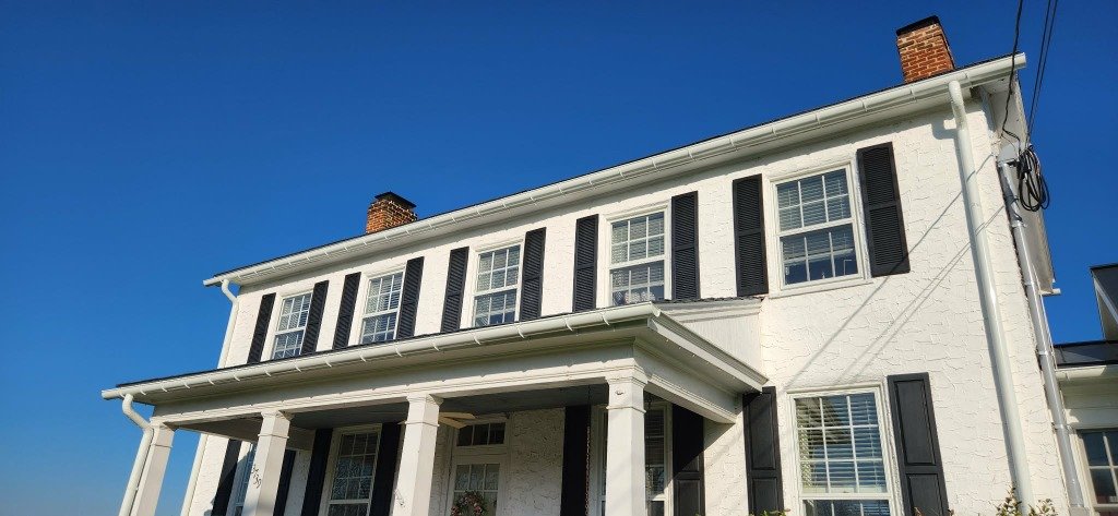 White colonial home new gutter installation Baltimore